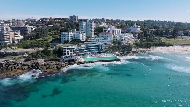 Aerial view of bondi beach with beautiful coastline and urban skyline, Sydney, Australia.
