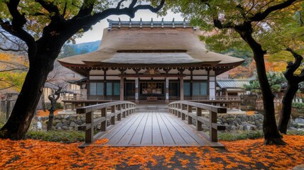 Fototapeta premium Traditional Japanese temple with lanterns, ornate wooden architecture, and serene surroundings, overlooking a calm landscape.