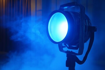 Bright Blue Stage Light Illuminating Smoky Atmosphere for Dramatic Artistic Performances in Theatrical Settings and Concert Venues
