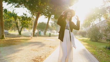 A Woman Happily Enjoying a Beautiful and Sunny Day Surrounded by Natures Splendor
