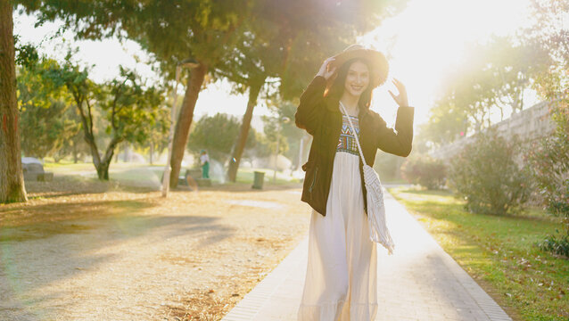 A Woman Happily Enjoying a Beautiful and Sunny Day Surrounded by Natures Splendor