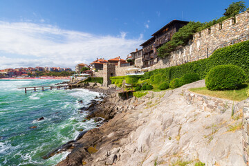 Naklejka premium sozopol, bulgaria - aug 09, 2015: southern fortress wall and tower. urban landscape. sunny morning. popular tourist attraction. late antique and medieval town. summer vacation