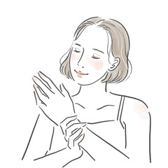 ハンドケアをして笑顔の若い女性の上半身