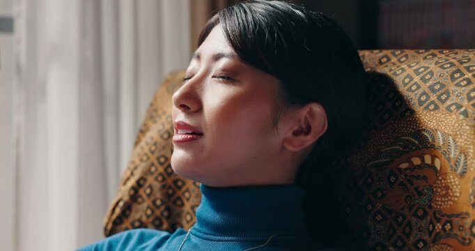 Japanese woman, thinking and relax in home for peace, calm or planning future vision. Asian person, smile and dream in living room for inspiration, remember memory or reflection of ideas with comfort