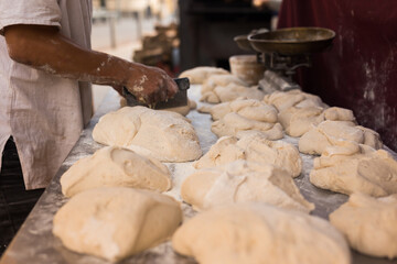 Fototapeta premium Yeast dough on baking table. cooking process