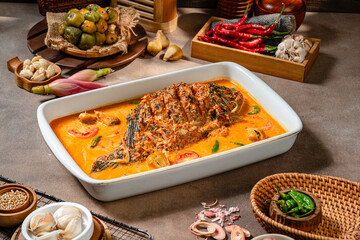 Fried Gourami cooked in spicy sour curry with asam cikala