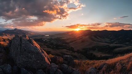 Fototapeta premium Breathtaking Sunset View from a Mountain Peak Overlooking a Scenic Valley with Vibrant Colors and Serene Landscape.