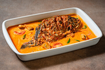 Fried Gourami cooked in spicy sour curry with asam cikala