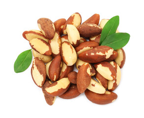 Fototapeta premium Tasty Brazil nuts and green leaves isolated on white, top view