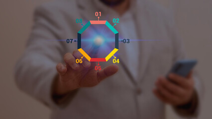 Businessman interacting with a colorful hexagonal infographic, representing data visualization,...