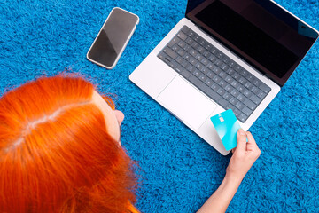 Shopping online at home with ease on a cozy blue carpet