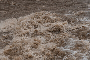 Turbulent Brown Water Waves Crashing in a Natural Setting