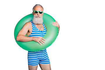 Portrait of attractive man with rubber circle looking in eyewear eyeglasses wearing striped costume...