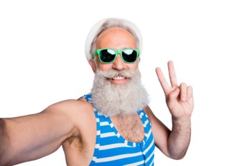 Close up photo of cheerful grandfather with eyewear eyeglasses making selfie v-signs wearing hat cap striped bathing suit panama sunhat isolated over blue background