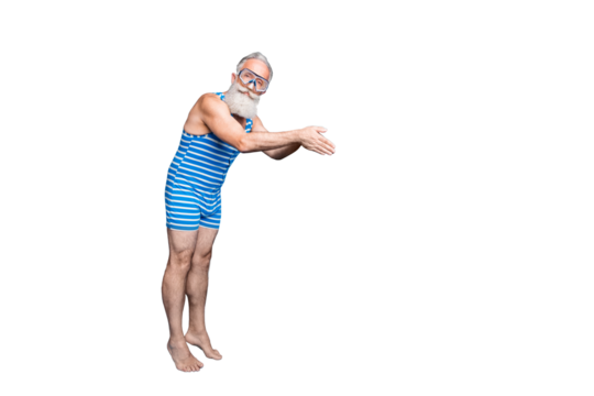 Full size photo of concentrated man jumping into ocean with equipment wearing striped bathing suit isolated over blue background