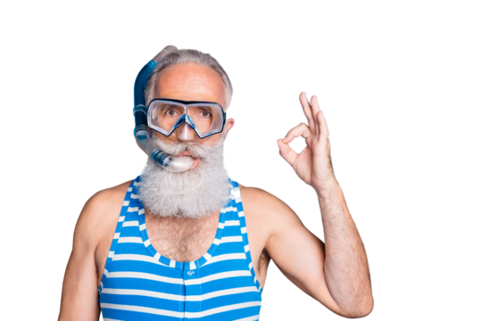 Close up photo of attractive man showing ok sign wearing snorkel gear striped bathing suit isolated over blue background