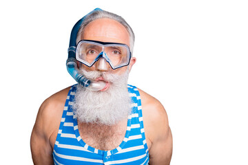 Close up photo of funky retired man having snorkel gear look wearing striped swim wear isolated...