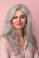 Naklejka premium Portrait of a Beautiful Senior Woman with Gray Hair, Smiling on a Pastel Background, with Copy Space
