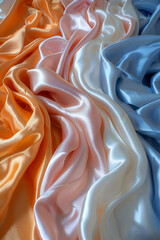Obraz premium Flowing orange, pink, white, blue satin.