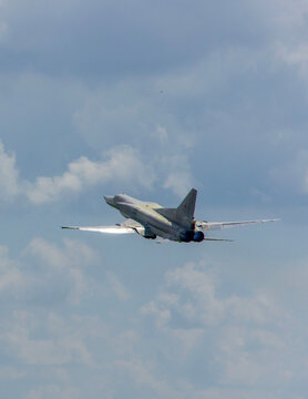 Preparation for 100th anniversary of Russian Air Force. Close-up. Tu-22M3 aircraft (NATO - Backfire) - missile-carrying bomber taking off from concrete runway. VillageTown, Russia, June 18, 2012