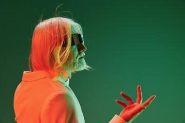 futuristic elderly man, profile, green background, colorful lighting, reflective sunglasses,...