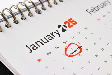 A close-up of a calendar page for January 2025, with the first day of the month, January 1st,...