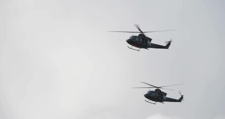 4K - American UH-1 multi-role helicopters in the sky