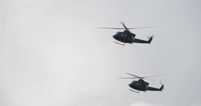 4K - American UH-1 multi-role helicopters in the sky