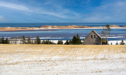 Ocean shoreline with sand dunes of northern Prince Edward Island, Canada.