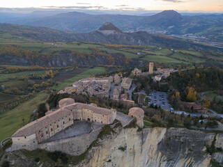 Italy November 24, 2024: aerial view of the village of San Leo with its fortress at sunset. We are in Emilia Romagna in the province of Rimini