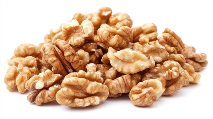 Freshly shelled walnuts arranged in a delightful mound showcasing their rich texture and warm golden-brown hues against a bright white background.