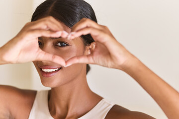 Woman Forms A Heart Shape With Hands, Expressing Love, Positivity, And Wellness. Bright Smile And...