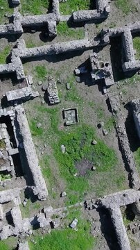 Overhead view of the stone ruins in Ugarit ancient city and archeological site, vertical video.