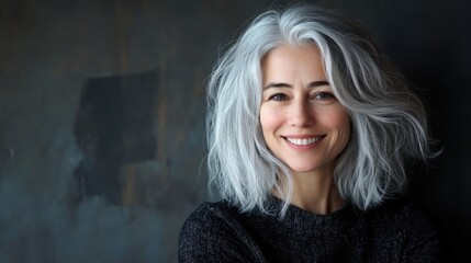 Fototapeta premium Portrait of a smiling woman with silver hair
