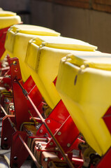 Close-up detail of plastic seeds recipients from a seeding machine