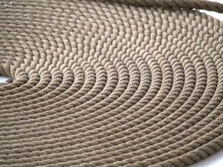 A coiled rope on the deck of an old sailing ship in Nyhaven, Copenhagen, Denmark