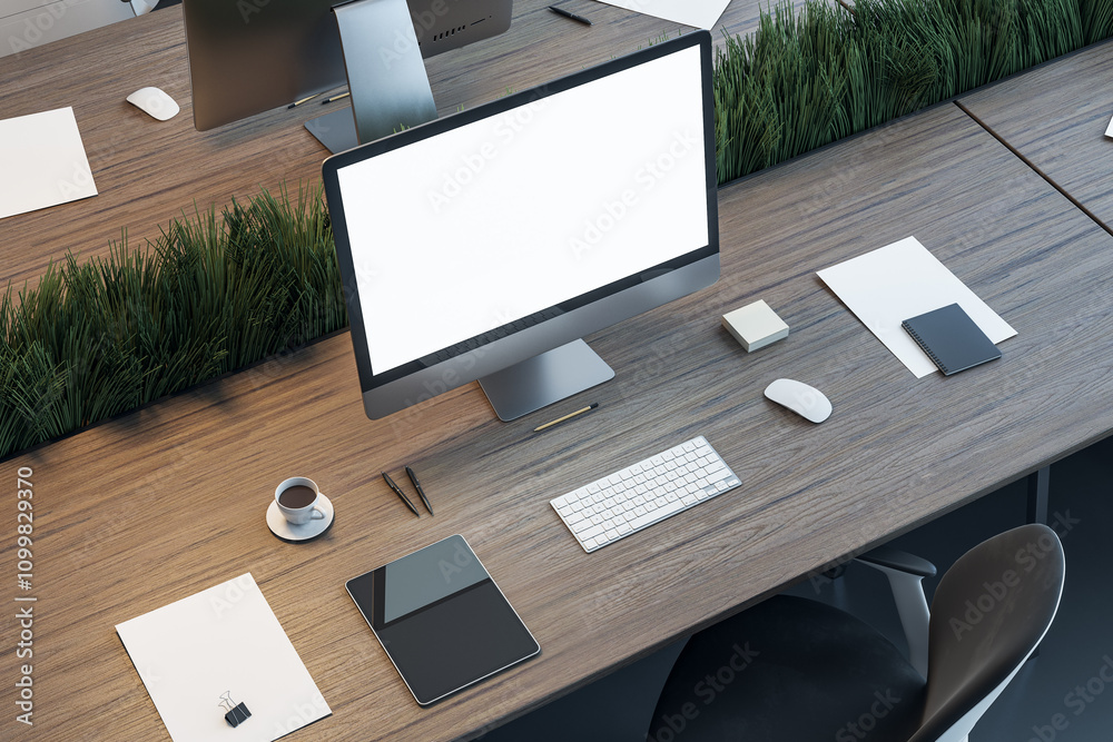 Poster Work place in coworking office separated by a partition of green grass with modern computer blank white screen, digital tablet, coffee cup and other tools on dark wooden table. 3D rendering, mock up