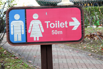 Public restroom sign on the street