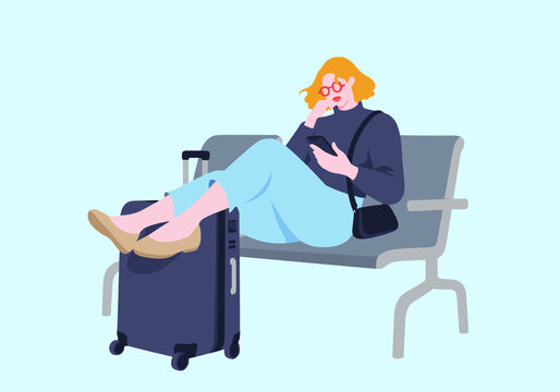 Woman with suitcase sitting on bench against turquoise background