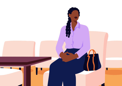 Young woman with purse sitting on sofa at medical clinic