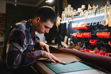 work in leather shop on dark background