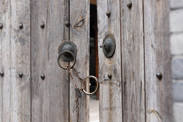 Vintage cymbals on wooden doors