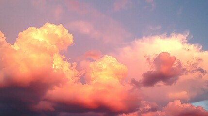 Fototapeta premium Vibrant sunset cloudscape with warm, orange and pink hues.