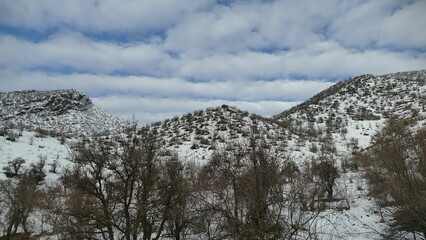 Snow-covered mountains in a serene winter landscape.