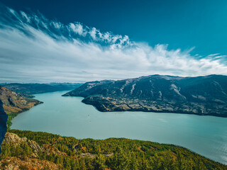 Fototapeta premium kanasi lake landscape or mountain view, scenery of mountain in China, travel destination or tour tourism, xinjiang, majestic panorama nature view. destination, blue sky, hill top, calmness.