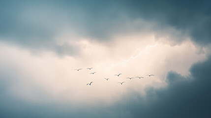 Fototapeta premium Dramatic Stormy Sky with Lightning and Migrating Birds