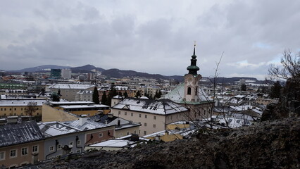 view of the city Salzburg covered in snow 