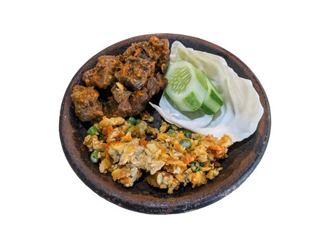 Paru Balado with spicy vegetable salad, and sliced cucumber on a cobek or plate made from clay. This is an traditional Indonesian menu for lunch or breakfast.