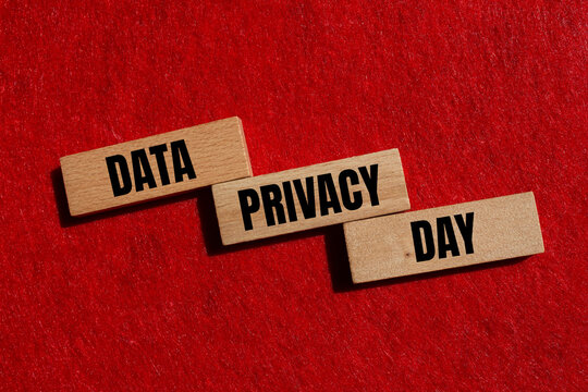 Data privacy day message written on wooden blocks with red background. Conceptual data privacy day symbol. Copy space.