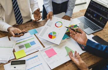 Meeting with financial advisors to analyze production costs and analyze marketing charts in...